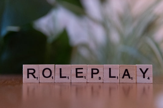 A wooden block spelling role play on a table